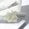 Pharmacian MELALESS 100,000 cream with white flowers Pharmacian MELALESS 100,000 cream with white flowers