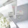 Pharmacian MELALESS 100,000 cream tubes and boxes with white flowers Pharmacian MELALESS 100,000 cream tubes and boxes with white flowers