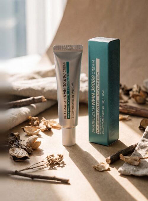 Pharmacian NMN30000 cream tube and box on linen Pharmacian NMN30000 cream tube and box on linen